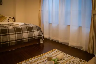 a bedroom with a bed and a rug on the floor at Ikebukuro mansion,4-6people,two bedrooms,subway 5mins in Tokyo