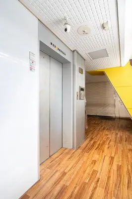 an empty room with a door and a wooden floor at Cozy Apartment, 2min to Station , Direct to Skytree, Asakusa & Ueno & Narita ,駅2分,スカイツリー浅草上野成田空港直結,エレベーター,スーパー2分,コンビニ1分 in Tokyo