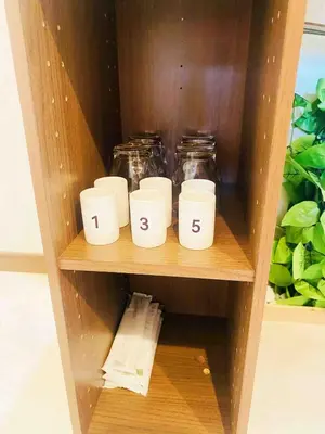 a shelf with four mason jars on it at Pine House 6 minutes by train to Ikebukuro 11 minutes to Shinjuku Convenient access to Ueno by train in Tokyo