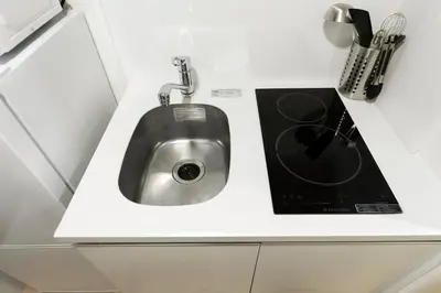 a kitchen counter with a sink in it at KOU Jiyugaoka 101 in Tokyo