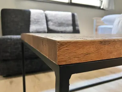 a wooden table in a room with a couch at KOU Jiyugaoka 202 in Tokyo