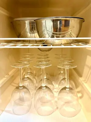 four wine glasses and a pot on a shelf in an oven at Ninja Tokyo Hideaway Higashi-Shinkoiwa in Tokyo