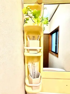 a shelf with a plant in it next to a door at Ninja Tokyo Hideaway Higashi-Shinkoiwa in Tokyo