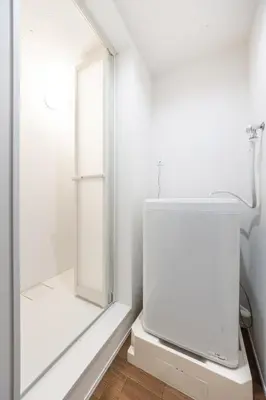 a white bathroom with a shower and a window at TRUSS 2nd in Tokyo