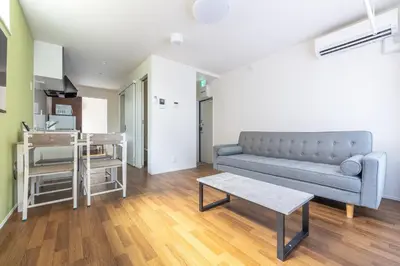 a living room with a couch and a table at TRUSS 2nd in Tokyo