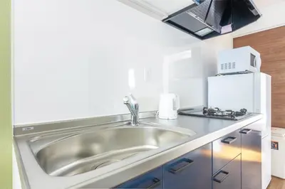 a kitchen with a sink and a microwave at TRUSS 2nd in Tokyo