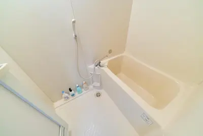 a small bathroom with a tub and a sink at Kita-Shinjuku INN House in Tokyo