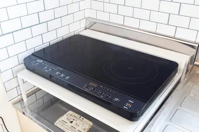 a stove top oven sitting on a shelf in a kitchen at LiveStay HIROO - 1BR and Cozy Living Area, 5th floor NO elevator, 34m2, 1-3 ppl, Hiroo Area, from Stn 10 min to Shibuya in Tokyo