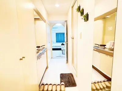 a hallway leading into a kitchen with a hallway leading into a room at Ikebukuro Cozy \u30cf\u30a6\u30b95 in Tokyo
