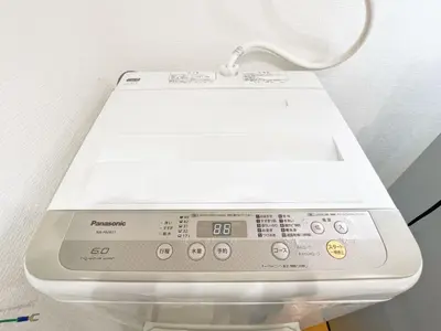 a white electronic device sitting on a table at Nogata Relaxing Home C1 in Tokyo