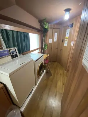 a kitchen with a washer and a sink in a room at \u795e\u7530\u5927\u624b\u753a\u30db\u30b9\u30c6\u30eb in Tokyo