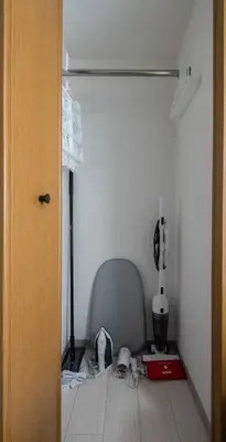 a room with a closet with a chair and a lamp at CraftFlat Numabukuro 301, uphill residence in Tokyo