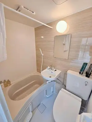 a bathroom with a tub and a toilet and a sink at \u6d45\u8349\u82b1\u65e5\u7f8e\u5c45 Asakusa Hanahi 201 Queen Bed Room, 4 min walk to Asakusa Temple, direct subway access to Narita and Haneda Airport in Tokyo