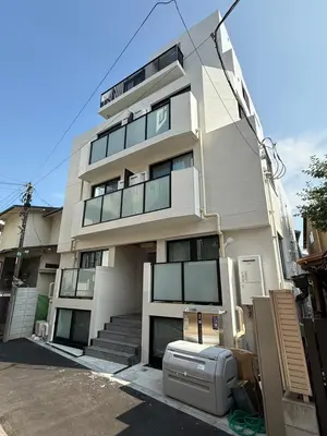a tall white building with a appliance in front of it at \u3055\u304f\u3089\u65c5\u9928\u9ad8\u5186\u5bfa\u5317\u5343\u5229\u4f11201\u53f7\u5ba4 in Tokyo