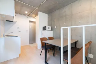 a kitchen and dining room with a table and chairs at PASEO\u5e02\u8c37\u53f0\u753al in Tokyo