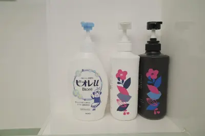 three bottles of detergents sitting on a shelf at \u5317\u533a\u99d2\u8fbc\u99c5 \u8fd1\u30a2\u30d1\u30fc\u30c8 \u6700\u592710\u540dstay OK in Tokyo