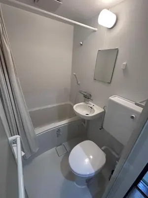 a white bathroom with a toilet and a sink at 1 stop in Ikebukuro,Direct access to Shinjuku,Shibuya,Tokyo Station and Tokyo Dome,Japanese-style single-family house,2-story detached house,MAX7 in Tokyo