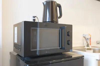 a microwave sitting on top of a counter at Senzoku, Taito City 101-TT0305 in Tokyo