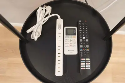 a wii remote control sitting on top of a table at Senzoku, Taito City 101-TT0305 in Tokyo