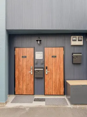 three doors on the side of a building at Senzoku, Taito City 101-TT0305 in Tokyo