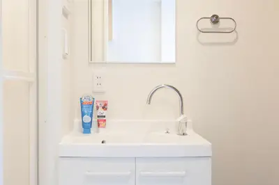 a bathroom with a white sink and a mirror at Senzoku, Taito City 101-TT0305 in Tokyo