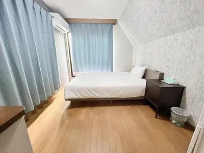 a small bedroom with a bed and a window at Shinjuku Homely House 4Rooms-D in Tokyo