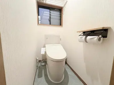 a bathroom with a toilet and a window at Shinjuku Homely House 4Rooms-D in Tokyo