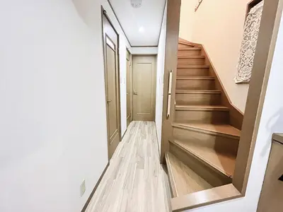 a hallway with stairs in a house at Shinjuku Homely House 4Rooms-D in Tokyo