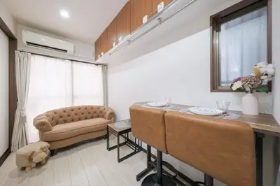 a living room with a couch and a table at Omo-Yado 20 minutes by car from Haneda Entire house in Tokyo