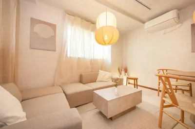 a living room with a couch and a table at Wooden house max 8 people 7 minutes walk to Skytree 75 square meters in Tokyo