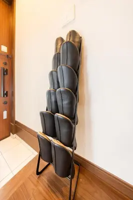 a black leather chair in a room at Wooden house max 8 people 7 minutes walk to Skytree 75 square meters in Tokyo