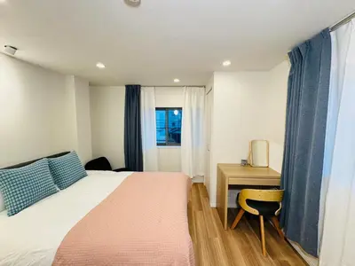 a bedroom with a bed and a desk and a window at Senzoku, Taito City 201-TT0306 in Tokyo