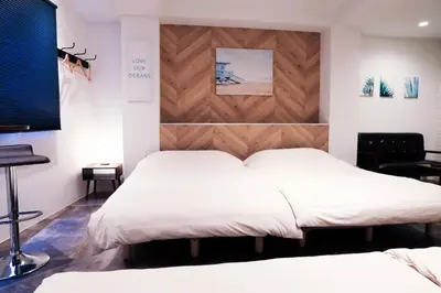a bedroom with two beds and a wooden headboard at WonderfulStayTOKYO Asakusa - Vacation STAY 68233v in Tokyo