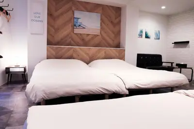 two beds in a room with white sheets at WonderfulStayTOKYO Asakusa - Vacation STAY 68233v in Tokyo