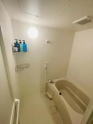 a bathroom with a tub and a light on the wall at WonderfulStayTOKYO Asakusa - Vacation STAY 68233v in Tokyo