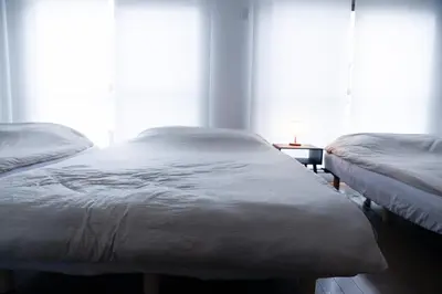 two twin beds in a room with a window at WonderfulStayTOKYO Asakusa - Vacation STAY 68472v in Tokyo