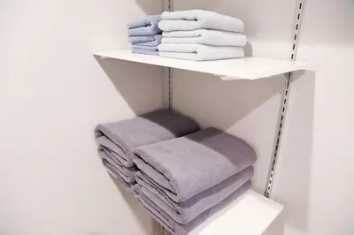 a stack of towels on a shelf in a bathroom at WonderfulStayTOKYO Asakusa - Vacation STAY 68472v in Tokyo