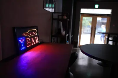 a dark room with a table and a neon light at WonderfulStayTOKYO Asakusa - Vacation STAY 68472v in Tokyo