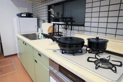 two pans sitting on a stove in a kitchen at Wonderful stay TOKYO Asakusa - Vacation STAY 96514v in Tokyo