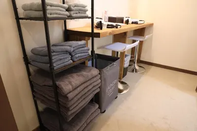 a stack of towels on a rack in a room at Wonderful stay TOKYO Asakusa - Vacation STAY 96514v in Tokyo