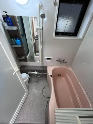 a bathroom with a pink tub and a toilet at Wonderful stay TOKYO Asakusa - Vacation STAY 96514v in Tokyo