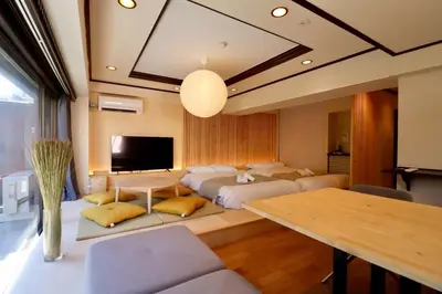 a room with four beds and a dining table at Sun Mall Crest 506 - Vacation STAY 19930 in Tokyo