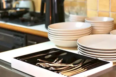 a tray of utensils sitting on a counter with plates and bowls at Sun Mall Crest 506 - Vacation STAY 19930 in Tokyo