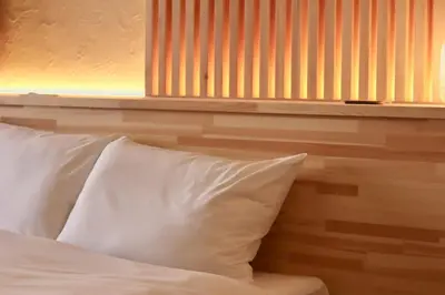 a bed with two white pillows in a room at Sun Mall Crest 506 - Vacation STAY 19930 in Tokyo