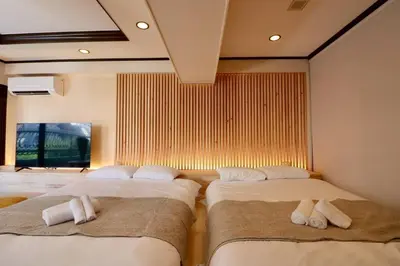 a bedroom with two beds with towels on them at Sun Mall Crest 506 - Vacation STAY 19930 in Tokyo