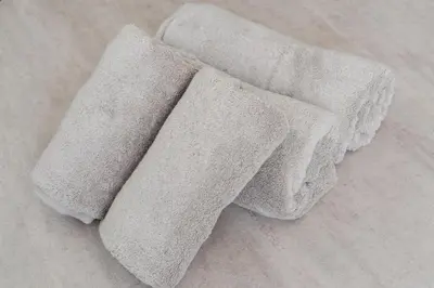 two white towels sitting on top of a floor at Intervia Horikiri in Tokyo