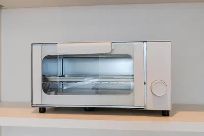 a silver toaster oven sitting on a table at Intervia Horikiri in Tokyo