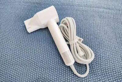a white hair dryer sitting on the floor at Sugamo hotel 2F-TS0335 in Tokyo