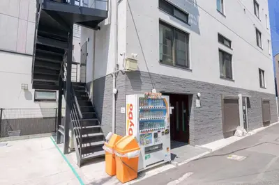 a building with a soda machine in front of it at Sugamo hotel 2F-TS0335 in Tokyo