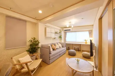 a living room with a couch and a table at Near Ueno House 7min Honkomagome 9min Sendagi in Tokyo
